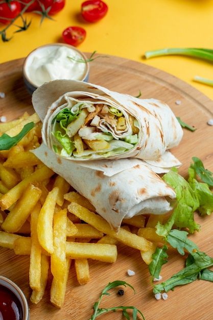 Free Photo chicken wrap served with fries