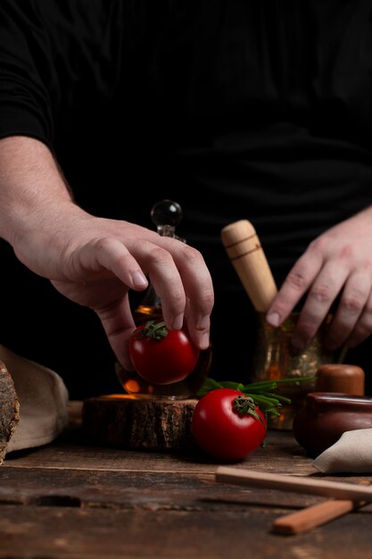 Chief is preparing tomato on desk