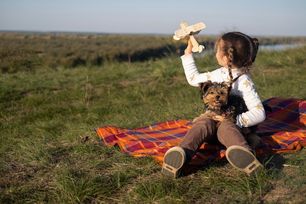 Child and dog playing with toys