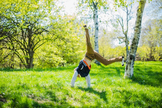 Child doing pirouettes in the grass