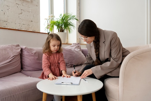 Child doing therapy session with psychologist