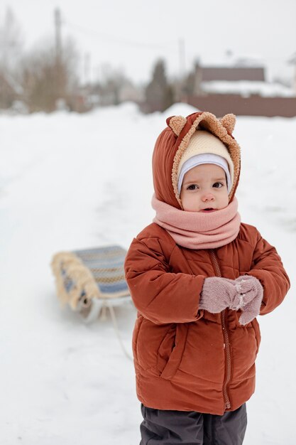 Child enjoying winter activities in the snow