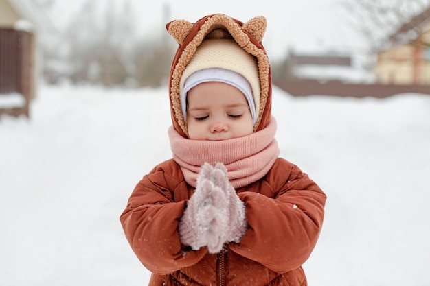 Child enjoying winter activities in the snow