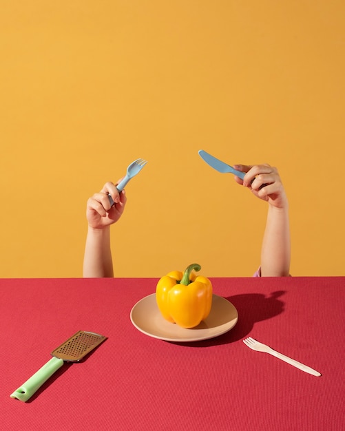 Free Photo child hand trying to reach food on table