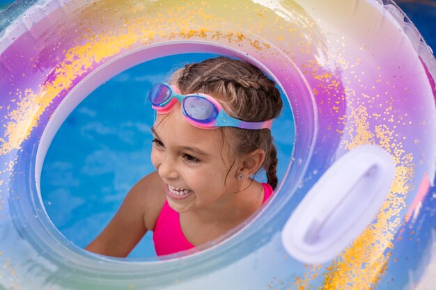 Child having fun with floater at the pool