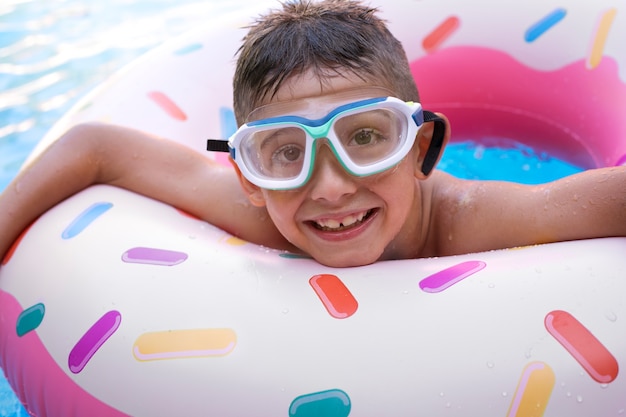 Child having fun with floater at the pool