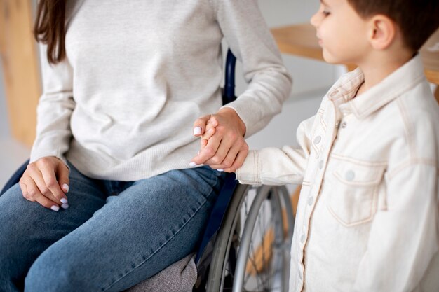 Child helping his disabled mother