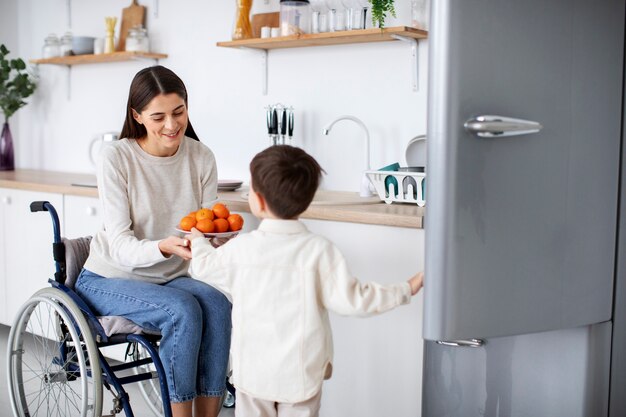 Child helping his disabled mother