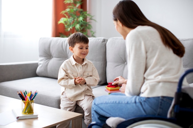 Child helping his disabled mother