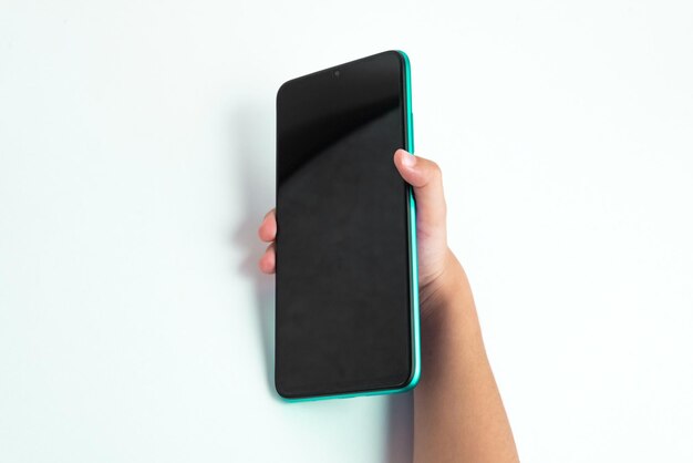 Child holding cellphone over white background