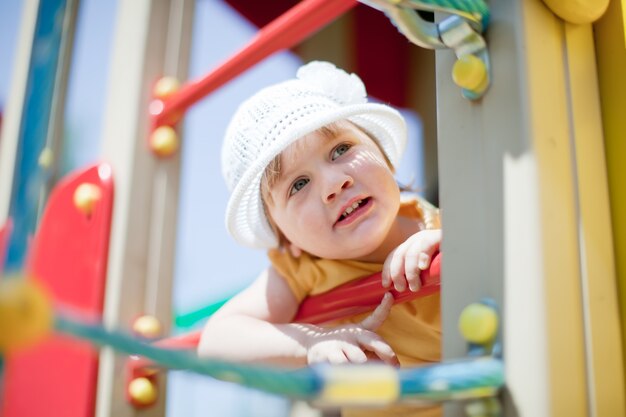 child at playground area in summer