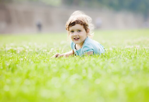 child playing at grass meadow