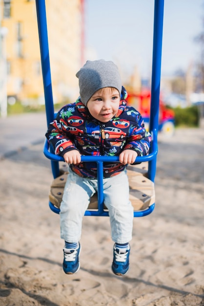 Child playing outside on playground