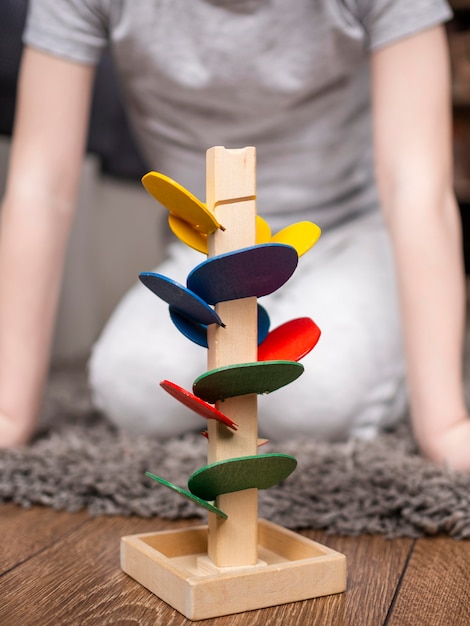 Free photo child playing with colorful wooden game