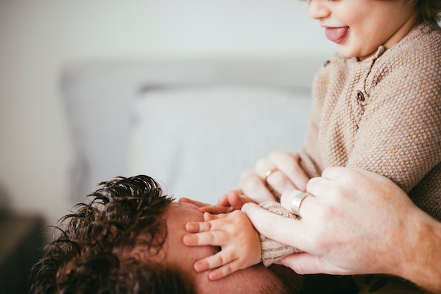 Child playing with father