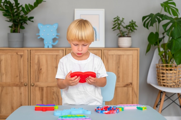 Free photo child playing with fidget at home