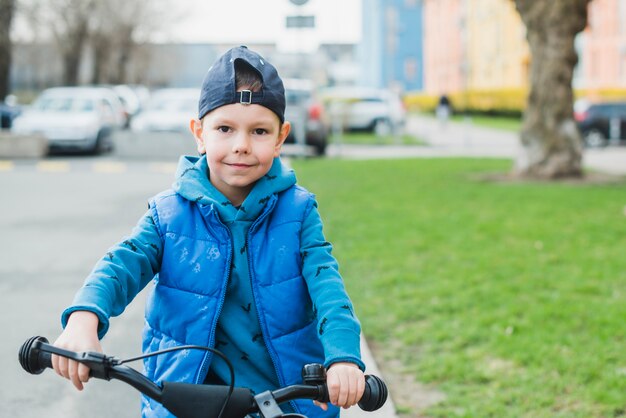 Child riding bike outside