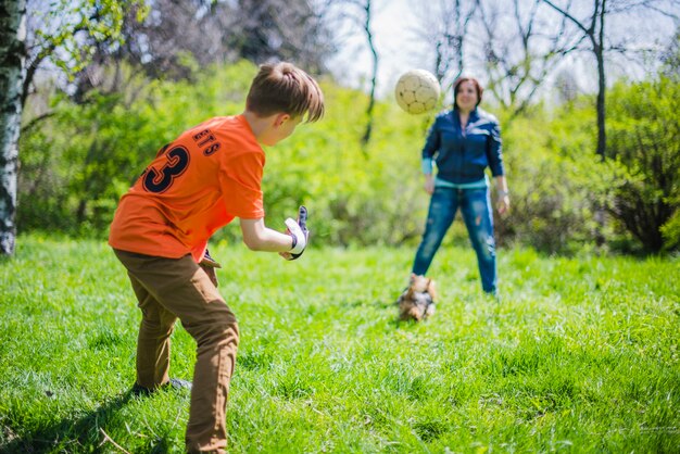 Child throwing the ball to his mother