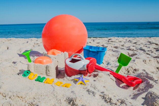 Child toys on sandy beach