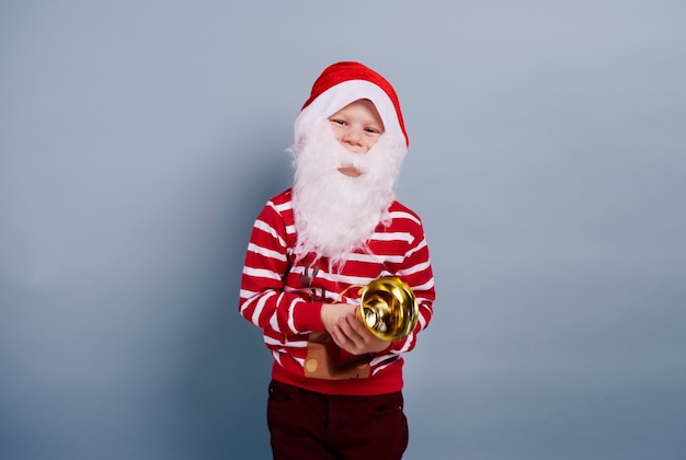 Free Photo child wearing santa hat and beard
