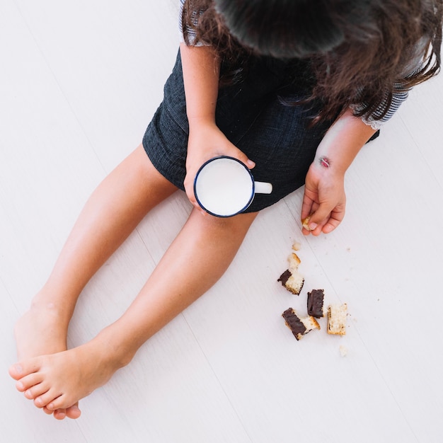 Free Photo child with milk and biscuits