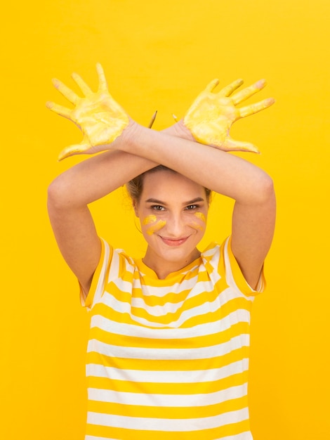 Free Photo childish woman with painted hands