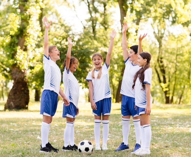 Children being happy after winning a football match