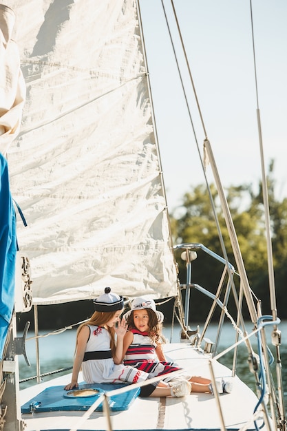 Free Photo the children on board of sea yacht. the teen or child girls outdoor. 