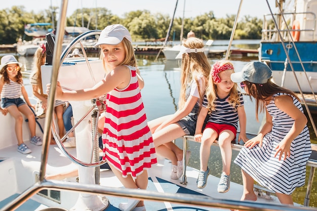 The children on board of sea yacht