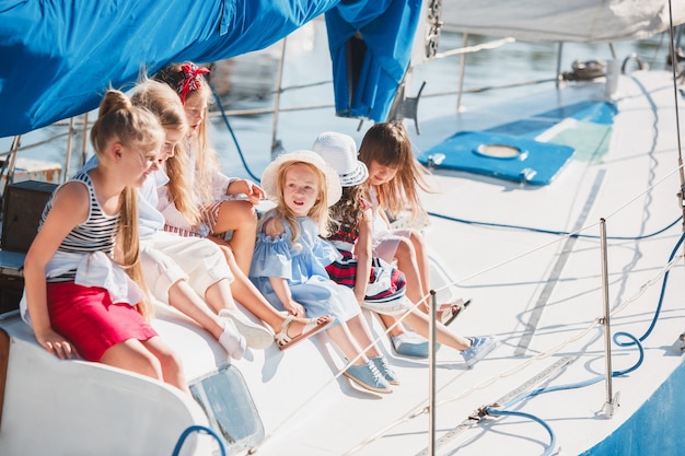 The children on board of sea yacht