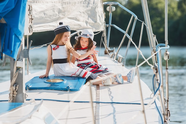 Free Photo the children on board of sea yacht