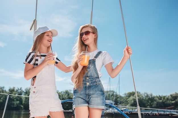 Free Photo the children on board of sea yacht