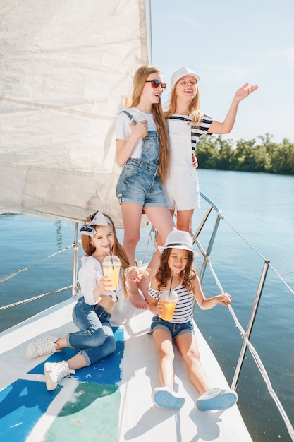 The children on board of sea yacht