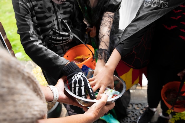 Children in costumes trick or treating on halloween