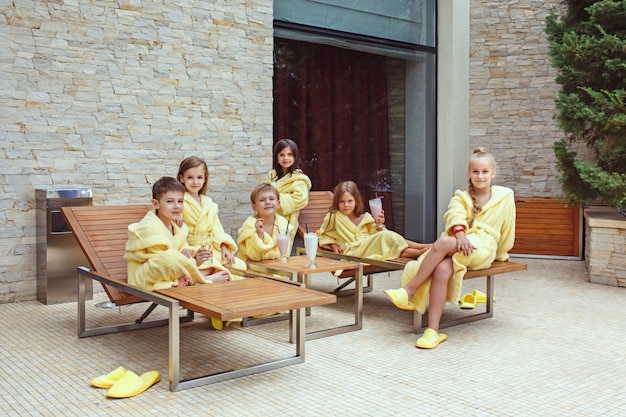 Free photo children drinking milkshakes outdoors