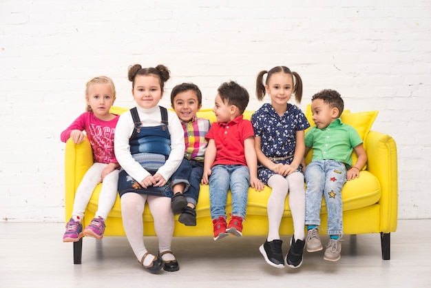 Children group in a sofa