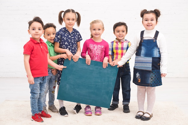 Free Photo children group with a blackboard