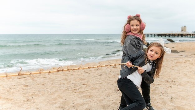 Children having fun by the sea