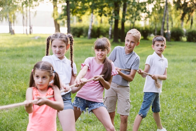 Children having fun in tug of war