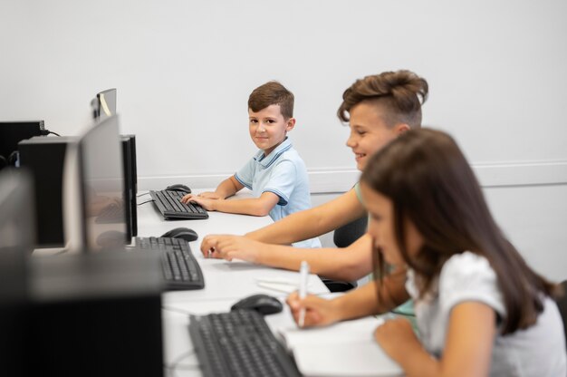 Children having technology education class