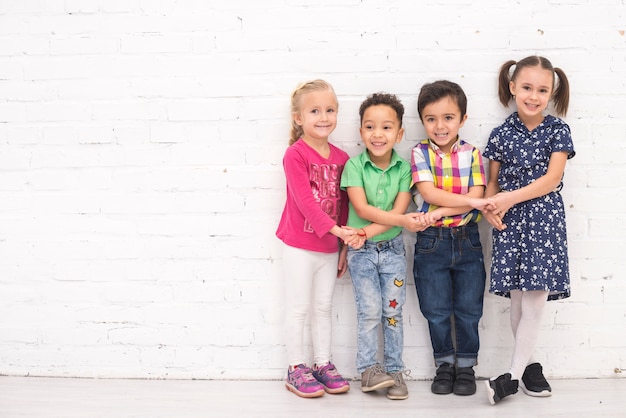 Free photo children holding hand in group