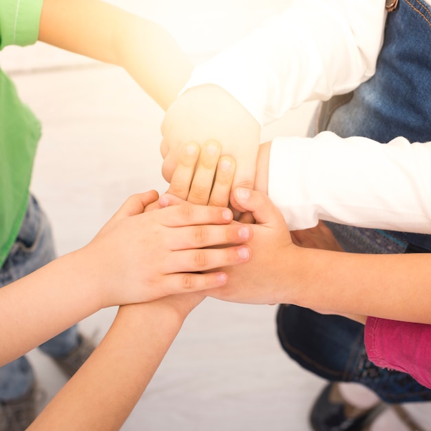 Free photo children holding hand in group