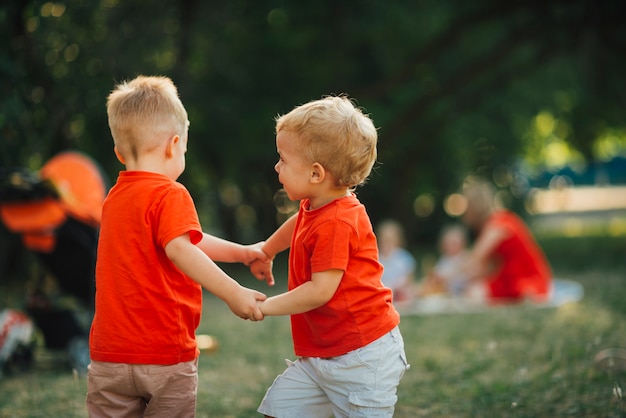 Children holding hands and playing outdoors