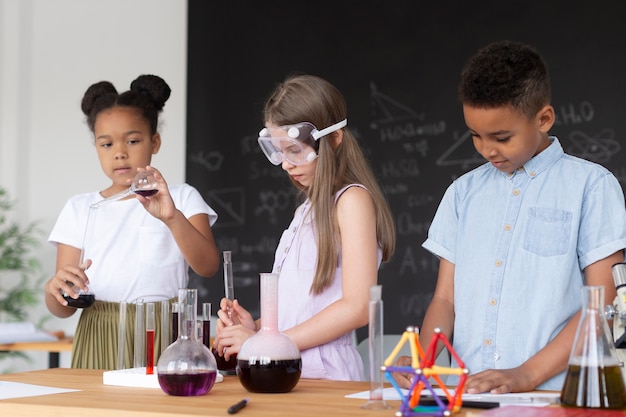 Children learning more about chemistry in class