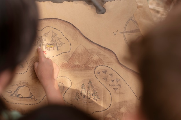 Free photo children participating in a treasure hunt in a forest