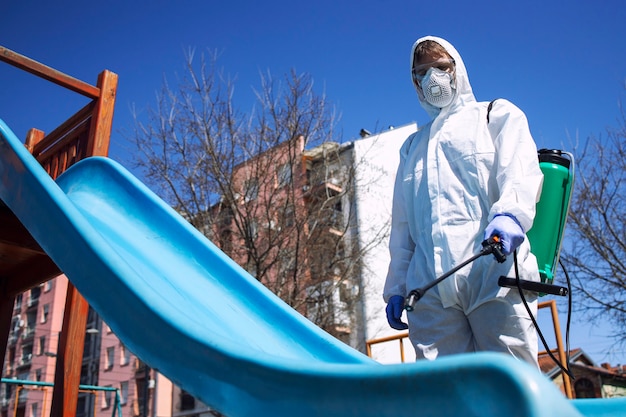 Children playground disinfecting and sanitizing against virus and disease