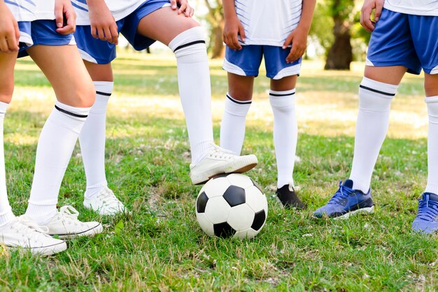 Children playing football outdoors