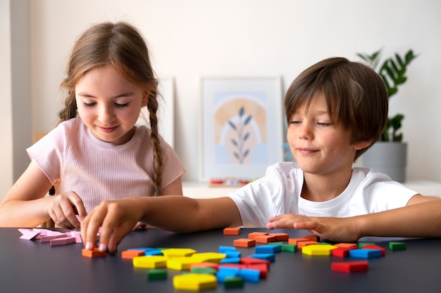 Children playing with brain teaser toys