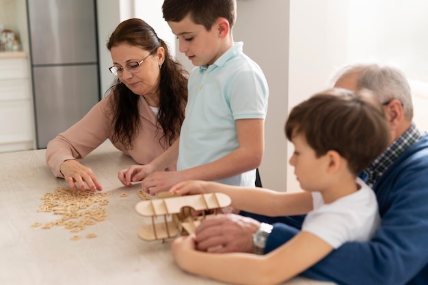 Children playing with their grandparents