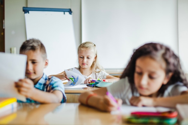 Children sitting in classroom studying